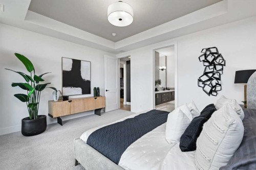 201-130 Marina Cove Se, Calgary, AB - Indoor Photo Showing Bedroom