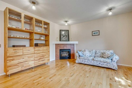 214 Springmere Close, Chestermere, AB - Indoor Photo Showing Other Room With Fireplace