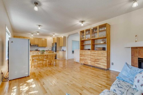 214 Springmere Close, Chestermere, AB - Indoor Photo Showing Living Room With Fireplace