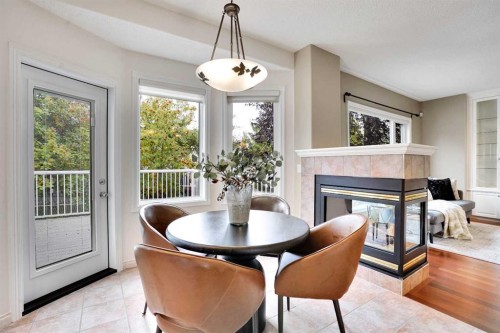38 Strathridge Crescent Sw, Calgary, AB - Indoor With Fireplace