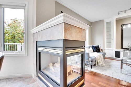 38 Strathridge Crescent Sw, Calgary, AB - Indoor With Fireplace