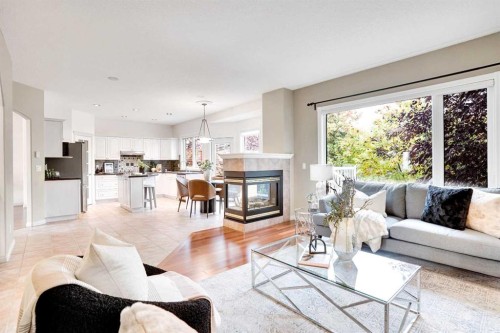 38 Strathridge Crescent Sw, Calgary, AB - Indoor Photo Showing Living Room With Fireplace