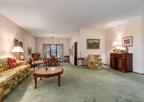 268 Pump Hill Gardens Sw, Calgary, AB - Indoor Photo Showing Living Room