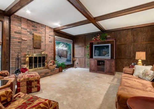 268 Pump Hill Gardens Sw, Calgary, AB - Indoor Photo Showing Living Room With Fireplace