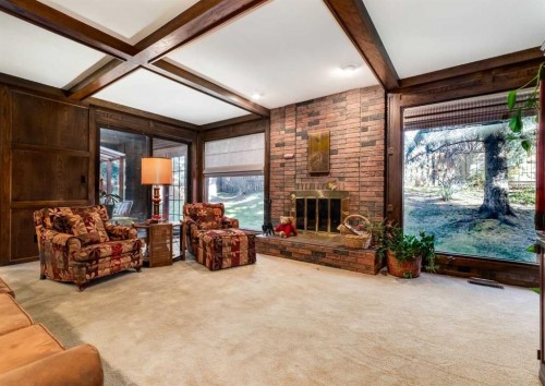 268 Pump Hill Gardens Sw, Calgary, AB - Indoor Photo Showing Living Room With Fireplace