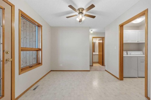 220 Sunset Place, Okotoks, AB - Indoor Photo Showing Laundry Room