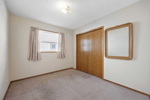 220 Sunset Place, Okotoks, AB - Indoor Photo Showing Other Room