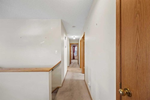 220 Sunset Place, Okotoks, AB - Indoor Photo Showing Other Room