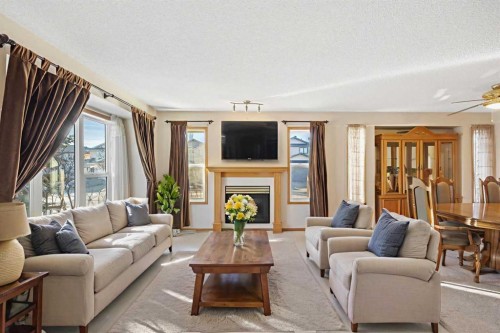 220 Sunset Place, Okotoks, AB - Indoor Photo Showing Living Room With Fireplace