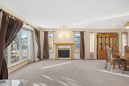220 Sunset Place, Okotoks, AB - Indoor Photo Showing Living Room With Fireplace