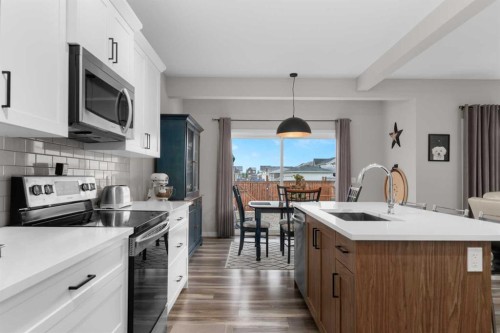 113 Amery Crescent, Crossfield, AB - Indoor Photo Showing Kitchen With Upgraded Kitchen