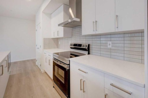 1209-550 Belmont Street Sw, Calgary, AB - Indoor Photo Showing Kitchen With Upgraded Kitchen