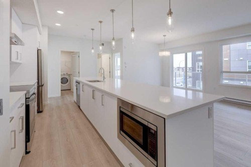 1209-550 Belmont Street Sw, Calgary, AB - Indoor Photo Showing Kitchen With Upgraded Kitchen