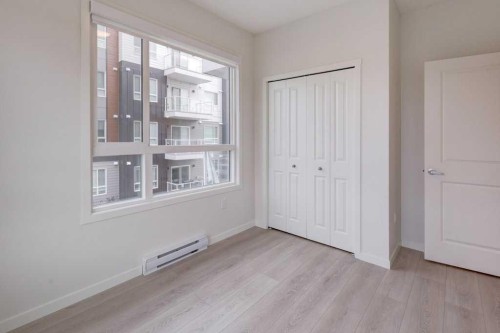 1209-550 Belmont Street Sw, Calgary, AB - Indoor Photo Showing Other Room