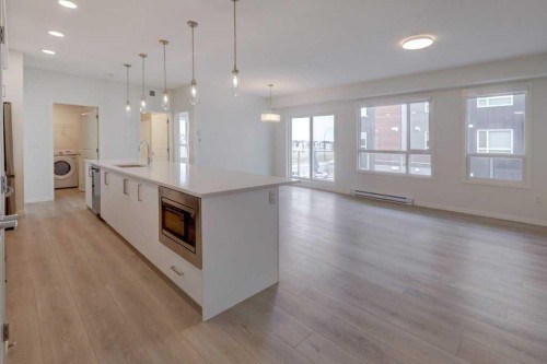 1209-550 Belmont Street Sw, Calgary, AB - Indoor Photo Showing Kitchen With Upgraded Kitchen