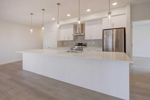 1209-550 Belmont Street Sw, Calgary, AB - Indoor Photo Showing Kitchen With Upgraded Kitchen