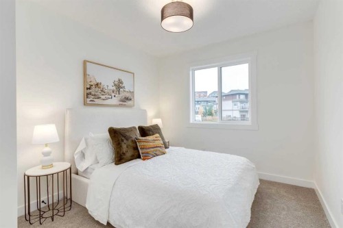 1507-525 River Heights Drive, Cochrane, AB - Indoor Photo Showing Bedroom