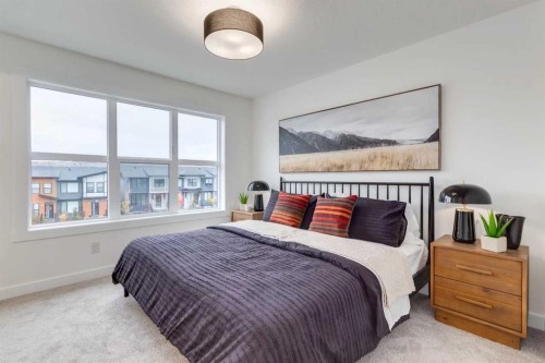 1507-525 River Heights Drive, Cochrane, AB - Indoor Photo Showing Bedroom