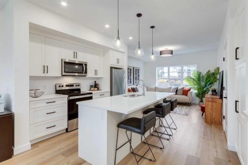 1507-525 River Heights Drive, Cochrane, AB - Indoor Photo Showing Kitchen With Stainless Steel Kitchen With Upgraded Kitchen
