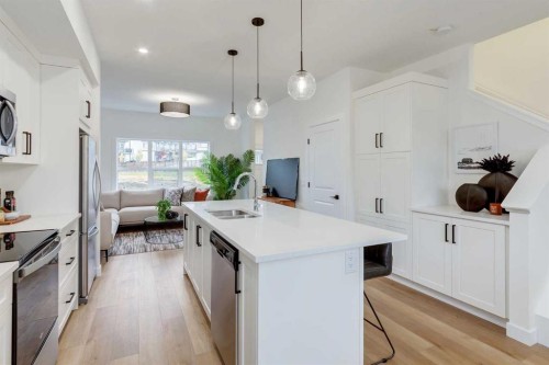 1507-525 River Heights Drive, Cochrane, AB - Indoor Photo Showing Kitchen With Double Sink With Upgraded Kitchen