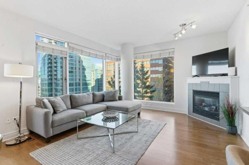 804-910 5 Avenue Sw, Calgary, AB - Indoor Photo Showing Living Room With Fireplace