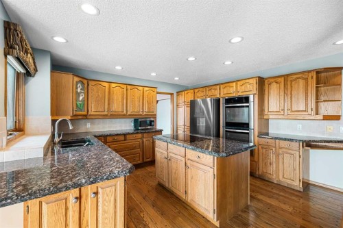 201 Signature Way Sw, Calgary, AB - Indoor Photo Showing Kitchen With Double Sink