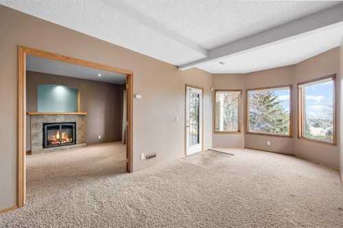 201 Signature Way Sw, Calgary, AB - Indoor With Fireplace