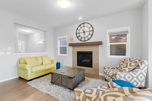 68 Morgan Street, Cochrane, AB - Indoor Photo Showing Living Room With Fireplace