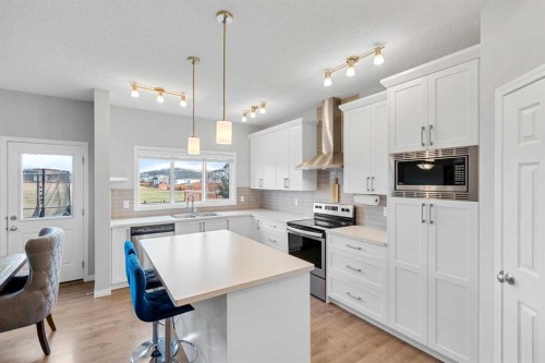 68 Morgan Street, Cochrane, AB - Indoor Photo Showing Kitchen With Upgraded Kitchen