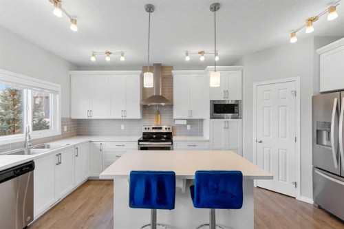 68 Morgan Street, Cochrane, AB - Indoor Photo Showing Kitchen With Double Sink With Upgraded Kitchen