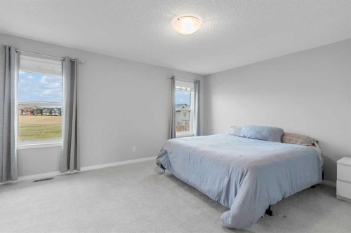 68 Morgan Street, Cochrane, AB - Indoor Photo Showing Bedroom