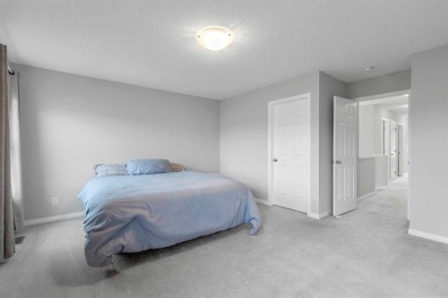 68 Morgan Street, Cochrane, AB - Indoor Photo Showing Bedroom