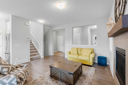 68 Morgan Street, Cochrane, AB - Indoor Photo Showing Living Room With Fireplace