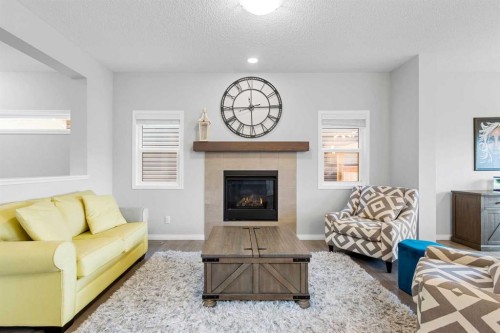 68 Morgan Street, Cochrane, AB - Indoor Photo Showing Living Room With Fireplace