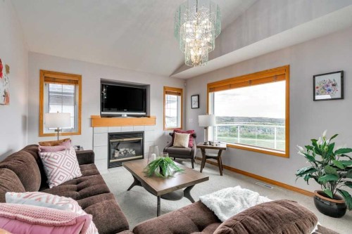 133 Chaparral Ridge Point Se, Calgary, AB - Indoor Photo Showing Living Room With Fireplace