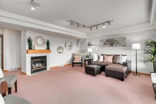 133 Chaparral Ridge Point Se, Calgary, AB - Indoor Photo Showing Living Room With Fireplace