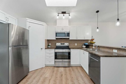 139 Auburn Bay Heights Se, Calgary, AB - Indoor Photo Showing Kitchen With Double Sink