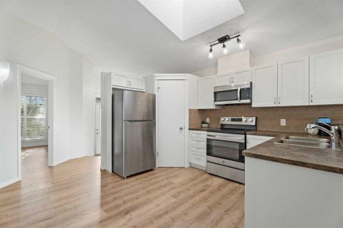 139 Auburn Bay Heights Se, Calgary, AB - Indoor Photo Showing Kitchen With Double Sink