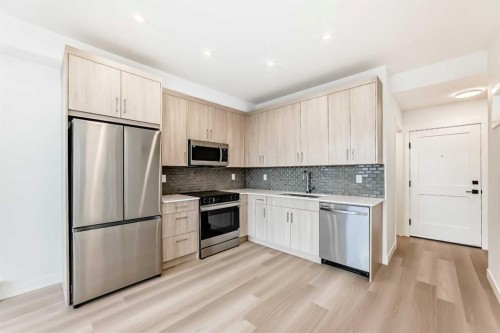 1411-430 Sage Hill Road Nw, Calgary, AB - Indoor Photo Showing Kitchen With Stainless Steel Kitchen With Upgraded Kitchen