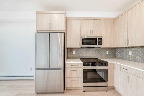 1411-430 Sage Hill Road Nw, Calgary, AB - Indoor Photo Showing Kitchen With Stainless Steel Kitchen With Upgraded Kitchen