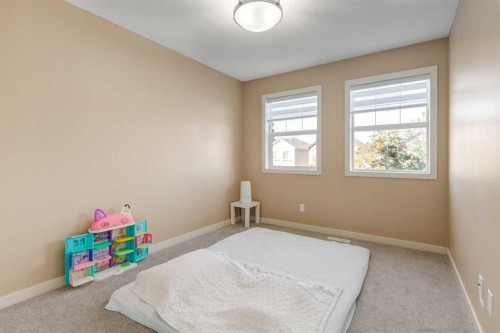 152 New Brighton Grove Se, Calgary, AB - Indoor Photo Showing Bedroom