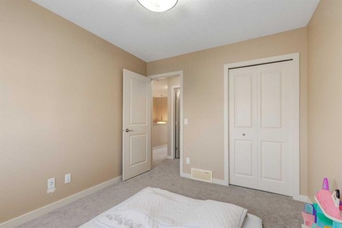 152 New Brighton Grove Se, Calgary, AB - Indoor Photo Showing Bedroom