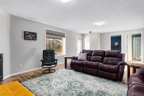 138 West Creek Springs, Chestermere, AB - Indoor Photo Showing Living Room With Fireplace