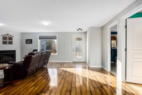 138 West Creek Springs, Chestermere, AB - Indoor Photo Showing Other Room With Fireplace