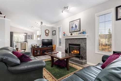 138 West Creek Springs, Chestermere, AB - Indoor Photo Showing Living Room With Fireplace