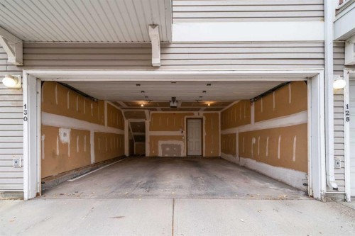 130 Promenade Way Se, Calgary, AB - Indoor Photo Showing Garage