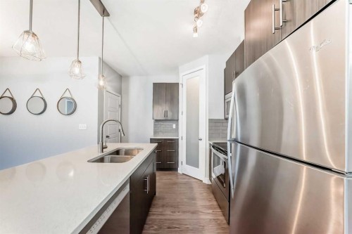 1213-2461 Baysprings Link Sw, Airdrie, AB - Indoor Photo Showing Kitchen With Stainless Steel Kitchen With Double Sink With Upgraded Kitchen