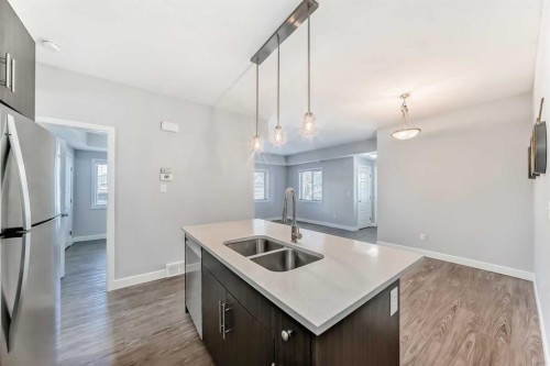 1213-2461 Baysprings Link Sw, Airdrie, AB - Indoor Photo Showing Kitchen With Double Sink