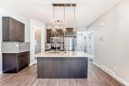 1213-2461 Baysprings Link Sw, Airdrie, AB - Indoor Photo Showing Kitchen With Stainless Steel Kitchen With Double Sink With Upgraded Kitchen