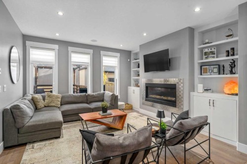 4528 17 Avenue Nw, Calgary, AB - Indoor Photo Showing Living Room With Fireplace